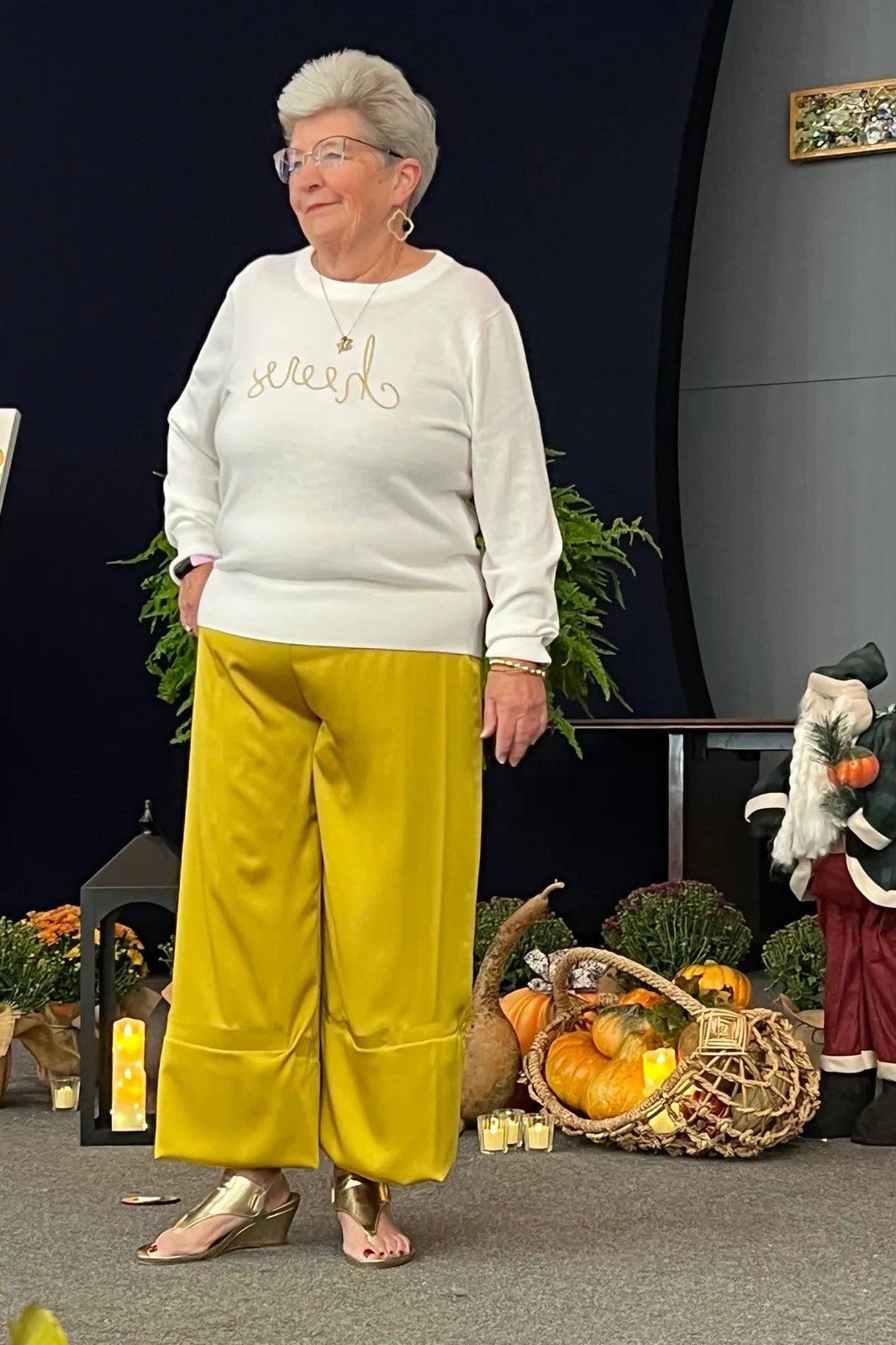 white cheers sweatshirt with mustard wide pants, Thanksgiving decor - fall outfit idea for women over 70