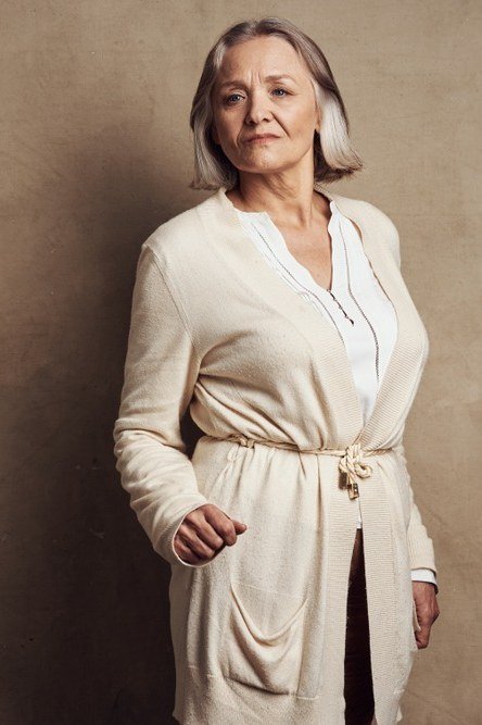 Cream belted cardigan over cream top and pants, full body front view - fall cardigan outfit idea for women over 60