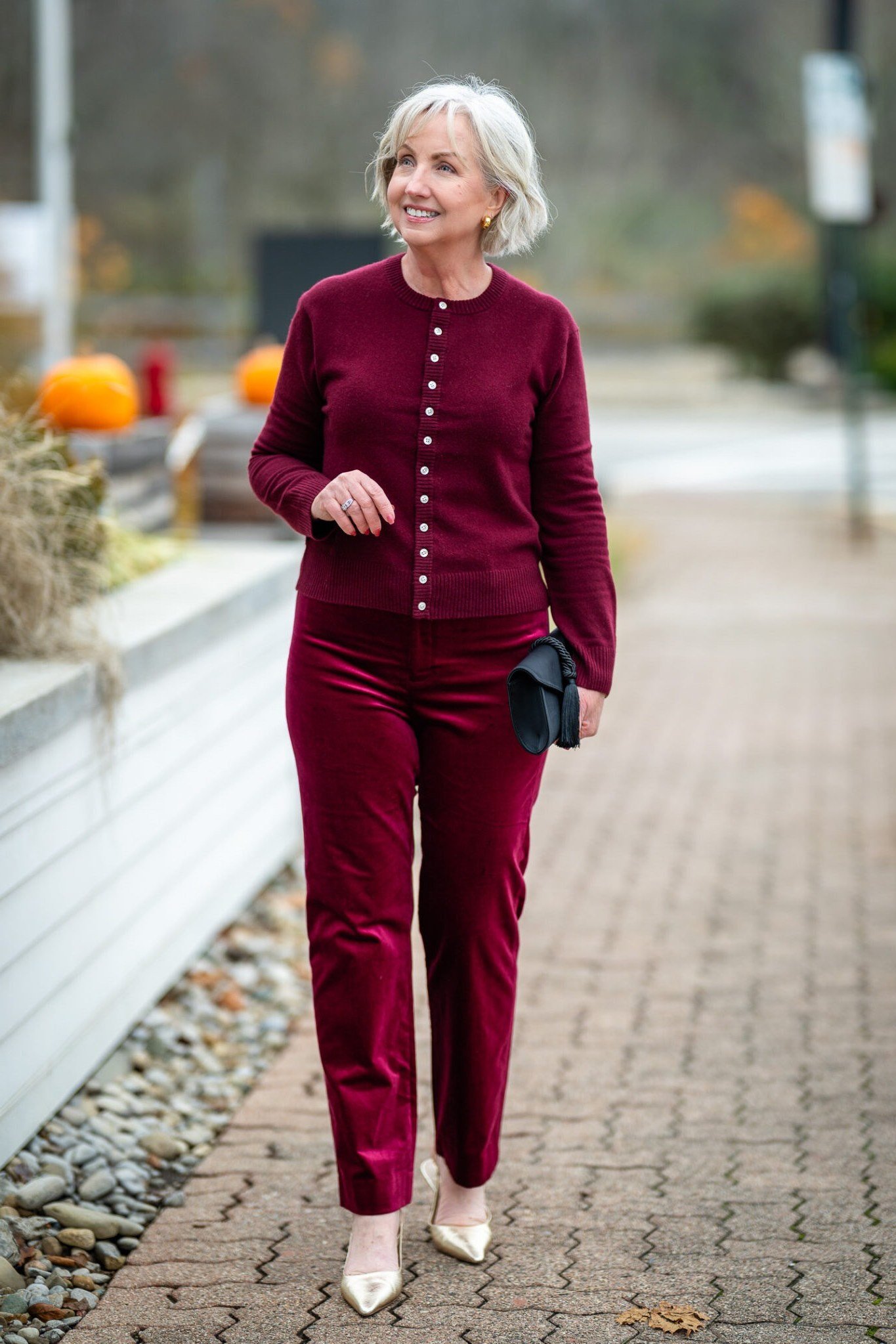Burgundy twinset cardigan and top with burgundy pants, full body front view - fall cardigan outfit idea for women over 60