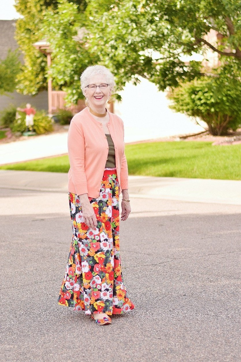 Peach cardigan over floral maxi dress, lawn, full body front view - fall cardigan outfit idea for women over 60