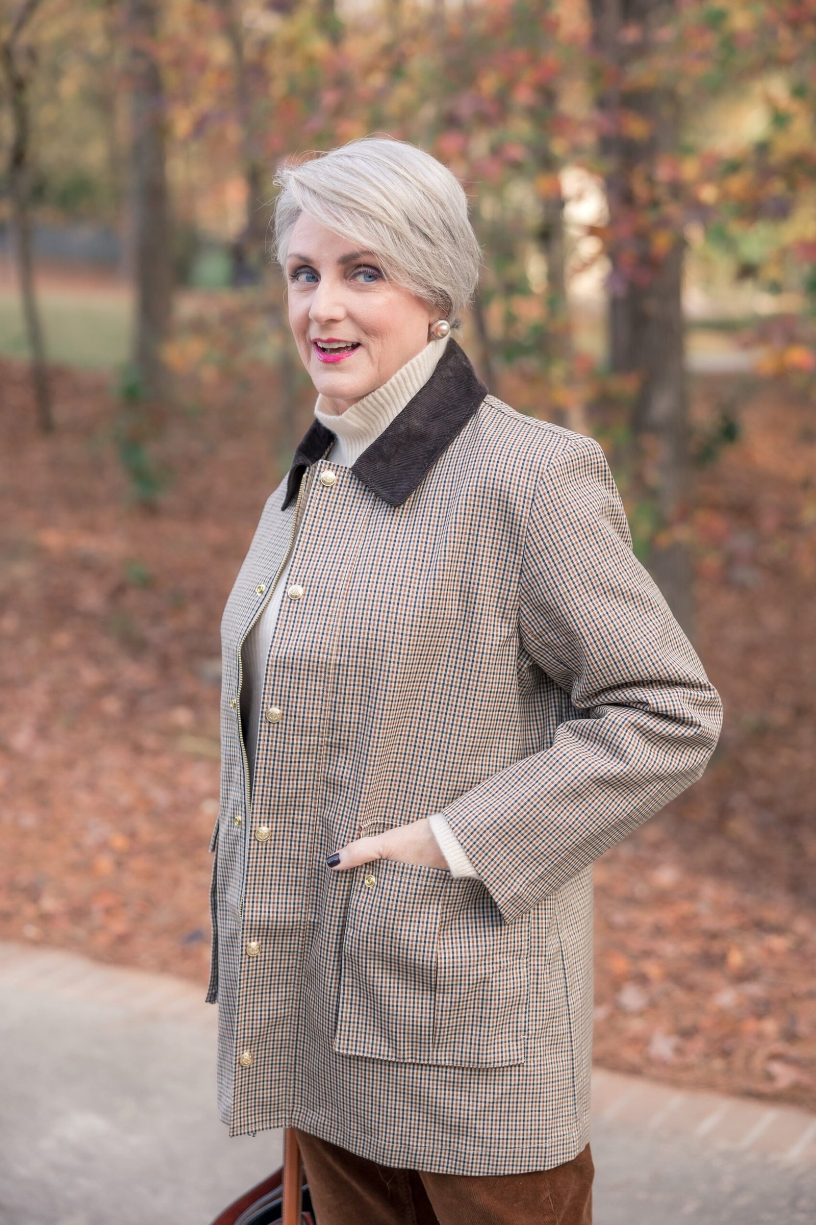 Woman in her 60s wearing a black and white houndstooth coat