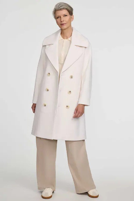 Fall dinner outfit for women over 50: white coat with cream top and cream wide-leg trousers