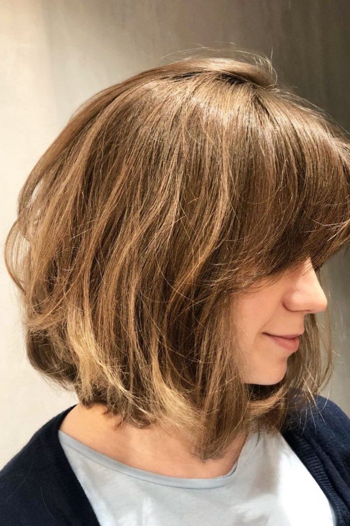 Layered Blonde Bob with Bangs fall hairstyle for women over 50