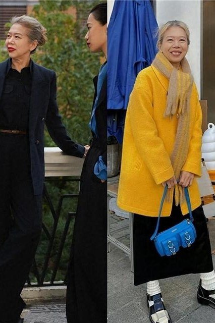 Two older women on a cafe terrace, one in a mustard yellow coat and one in a black pantsuit - stylish fall look for older women