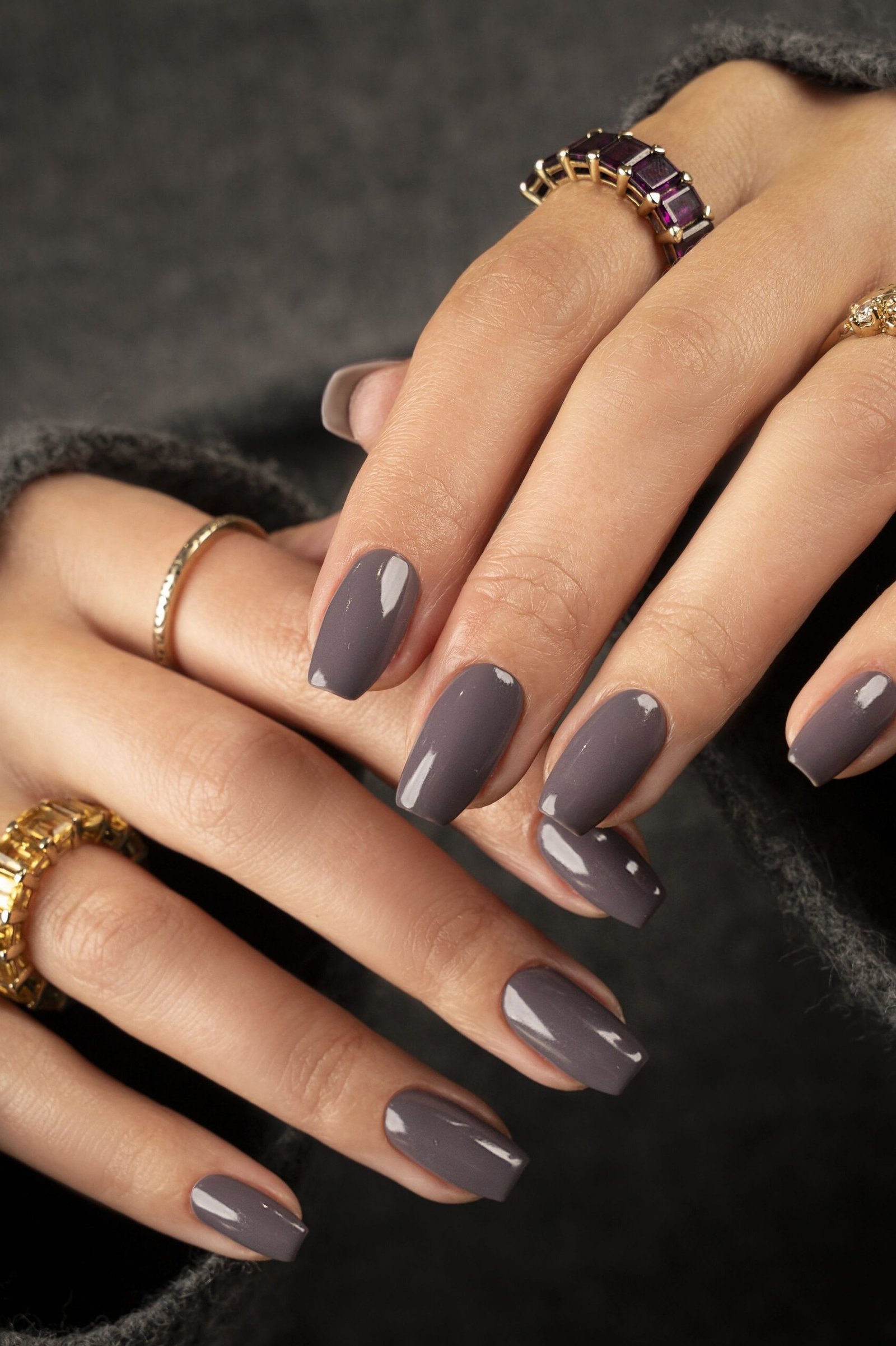 Dark gray-purple nails with gold rings