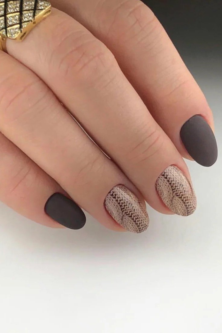 Dark gray matte nails with a snake print accent nail