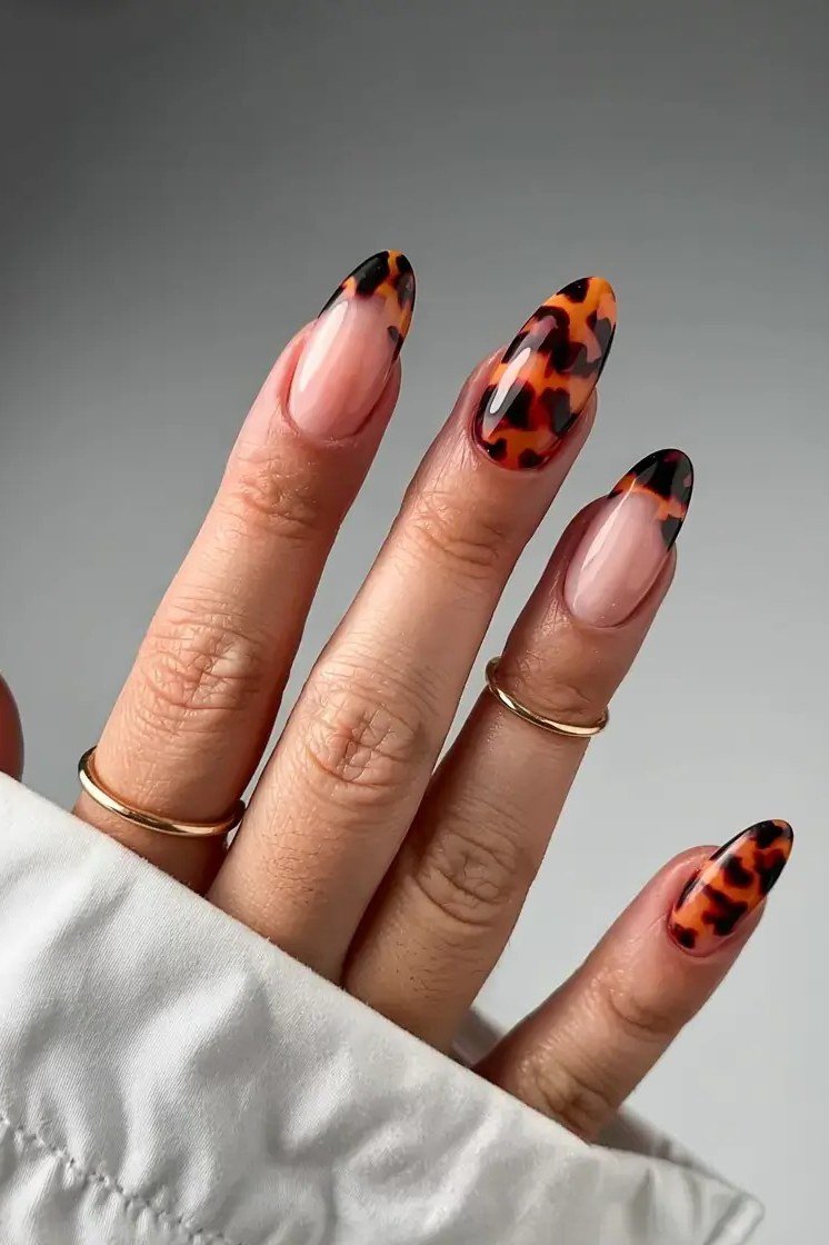 Tortoise French tips on nude oval nails