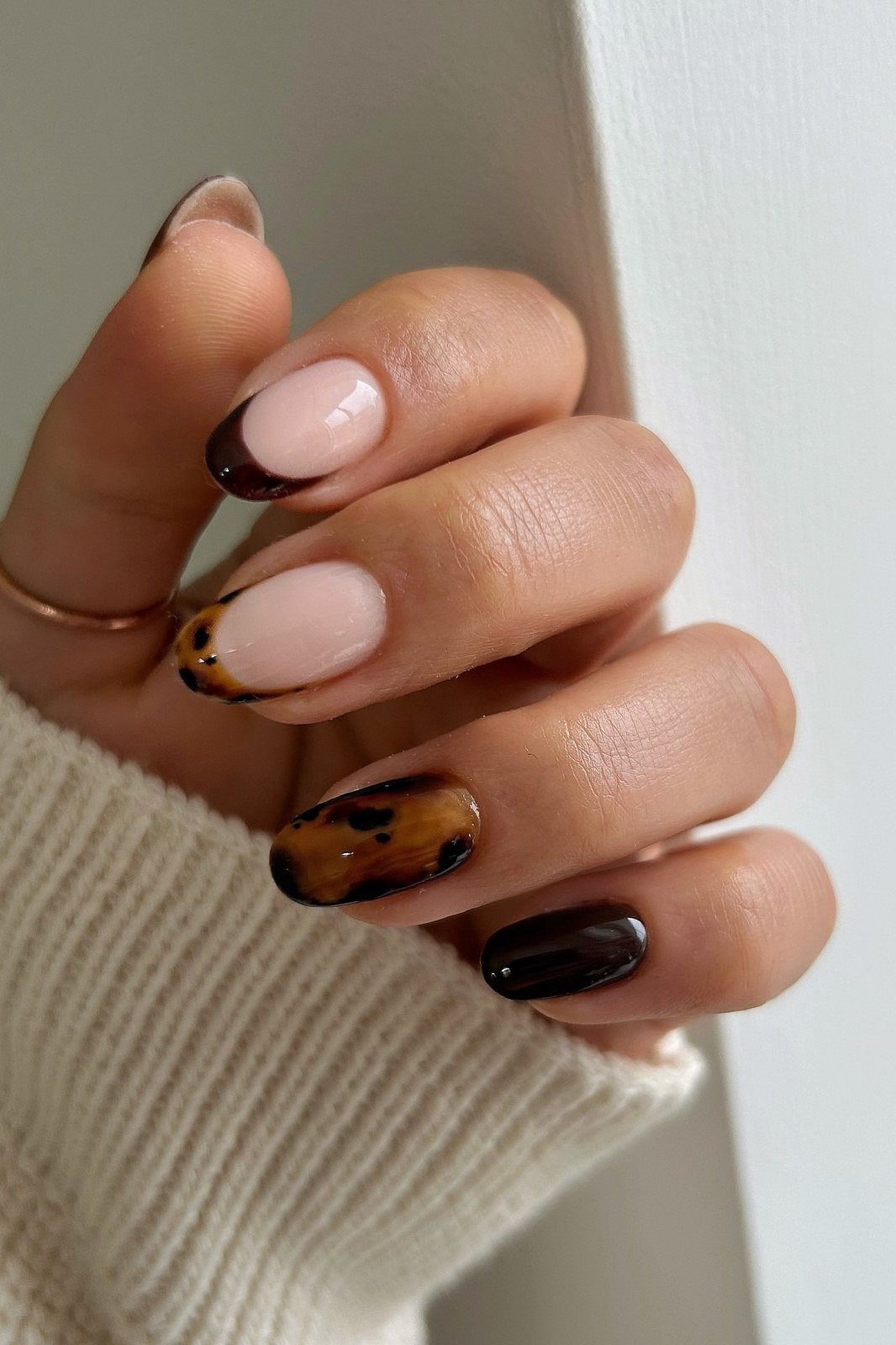 Nude nails with tortoise French tips
