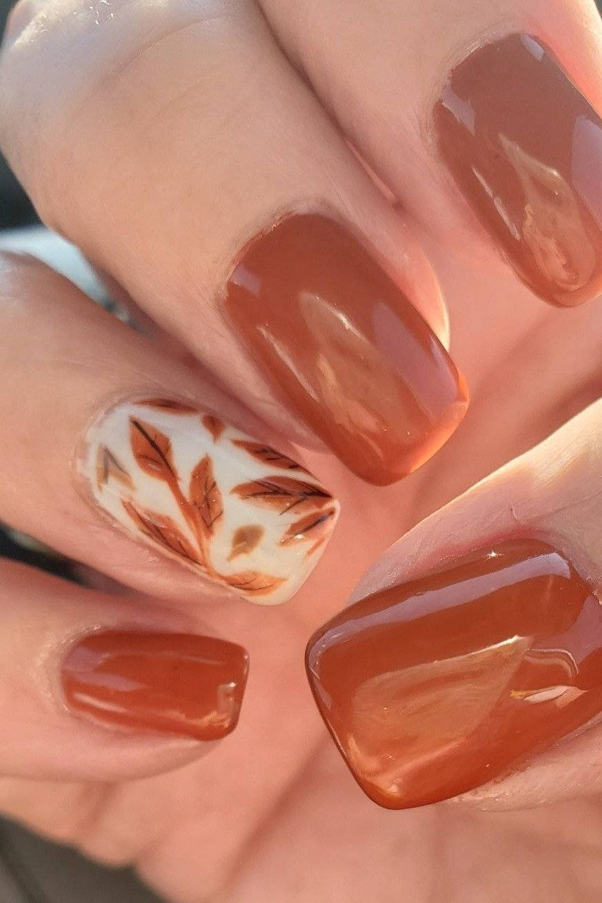 Burnt orange square nails with leaf art