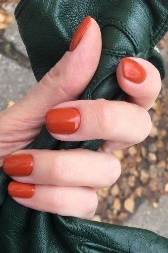 Bright orange short square fall nails for women over 60