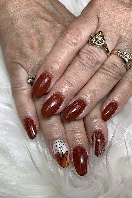 Oxblood nails with gold glitter accent for women over 60