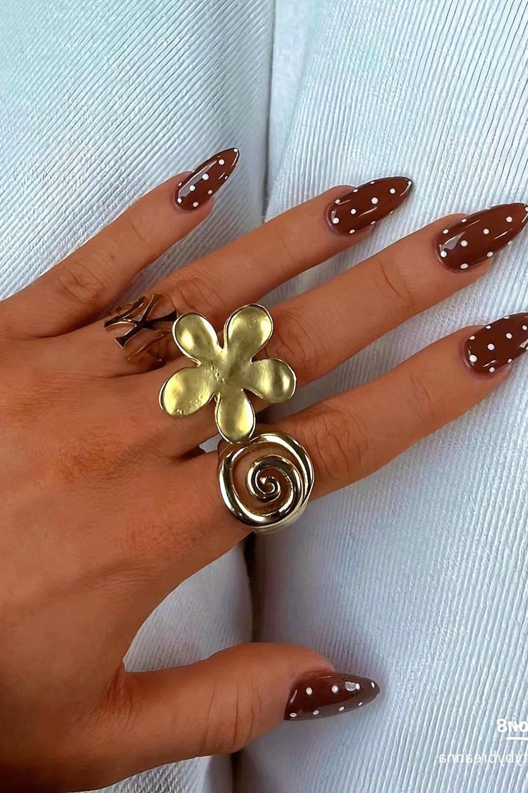 Chocolate nails with white polka dots for women over 60