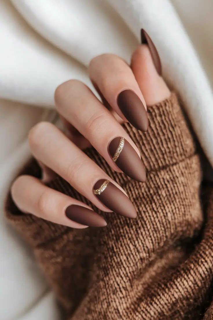 Chocolate nails with gold line accents for women over 60