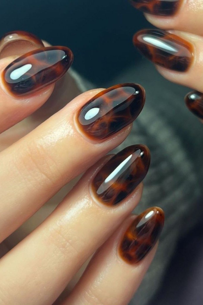 Glossy tortoiseshell almond nails for women over 60