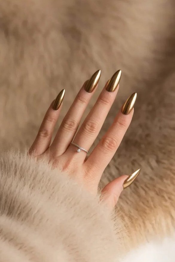 Gold chrome almond nails for women over 60
