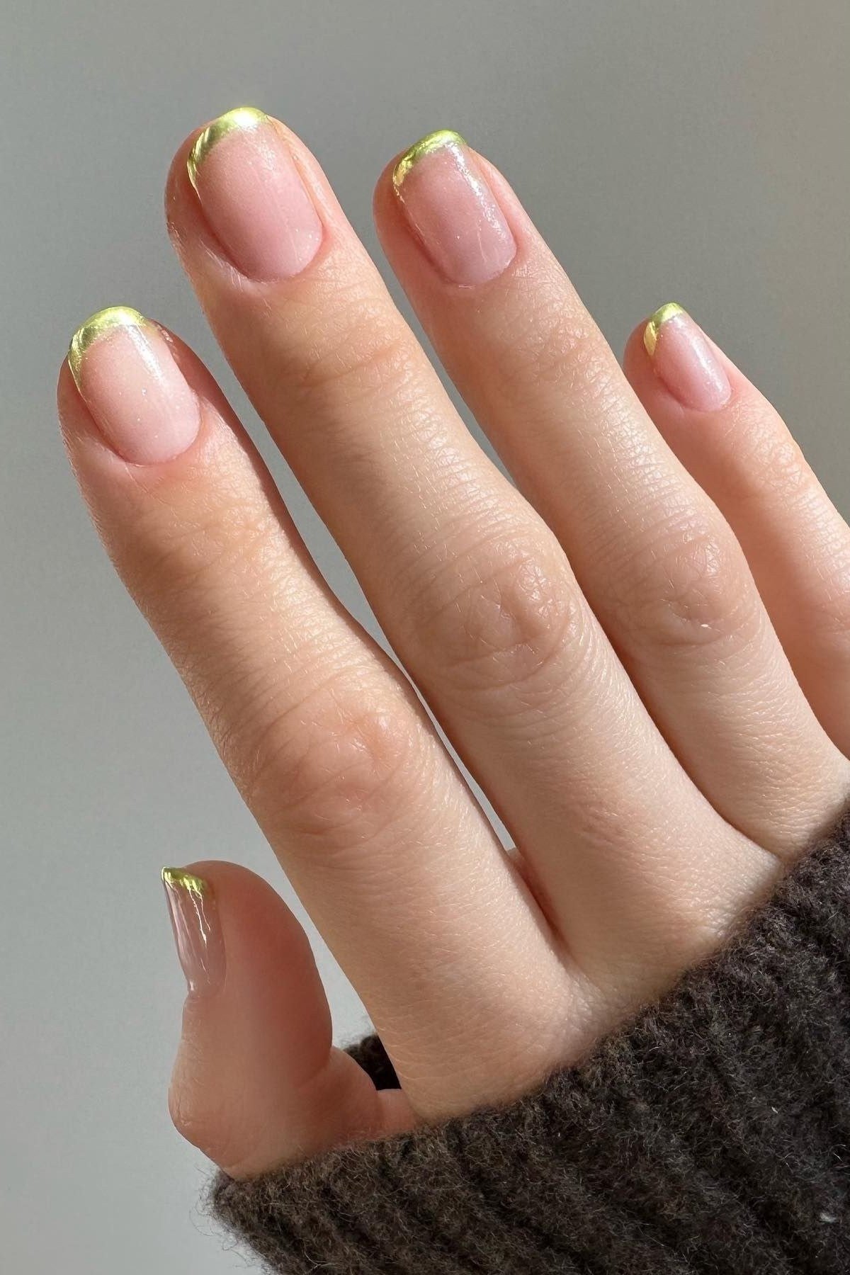 Nude nails with thin elegant gold tip accents