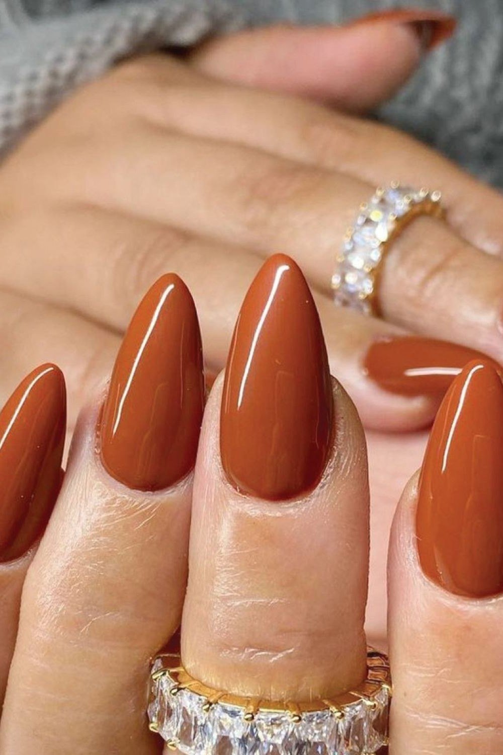 Burnt orange stiletto nails with glossy finish