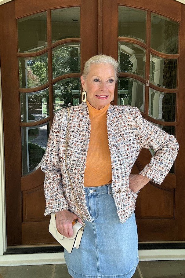 Tweed jacket with orange top and jeans fall outfit for women over 50