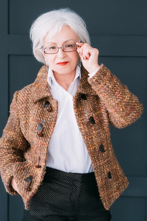 Brown tweed jacket with white shirt and dark trousers