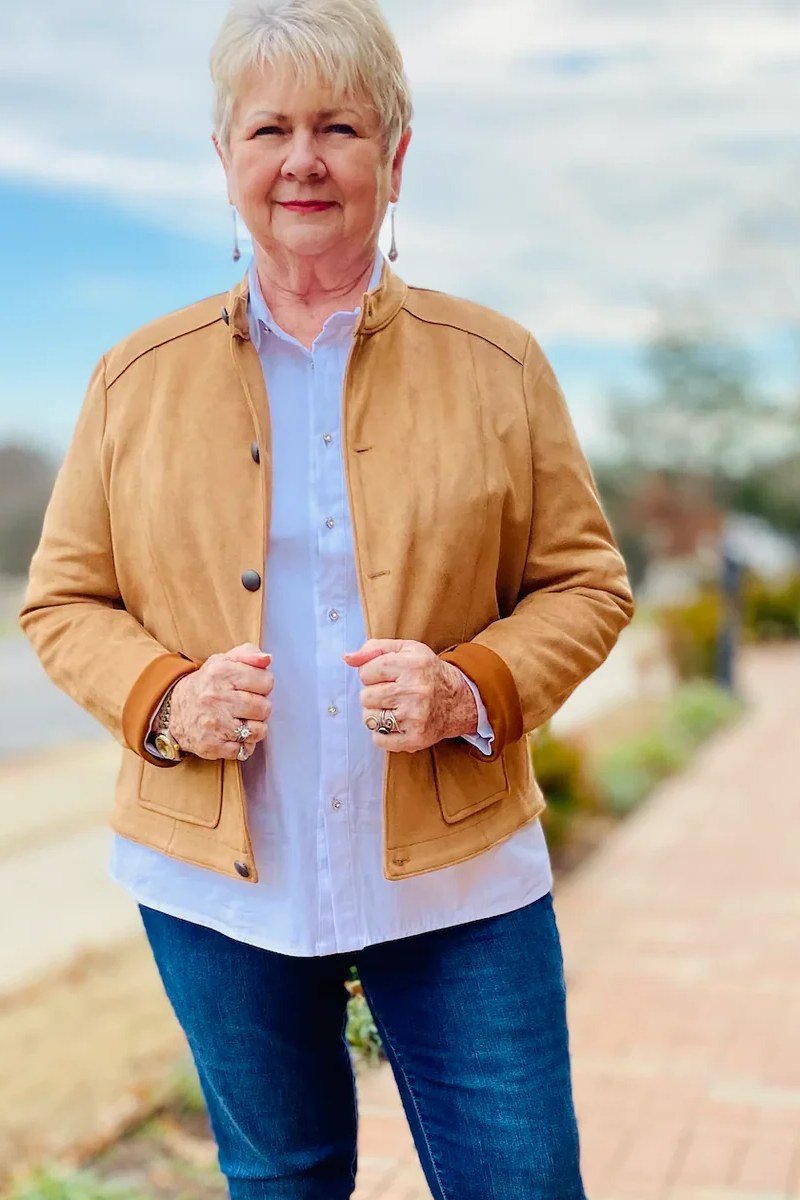 Tan suede trucker jacket with white shirt and jeans
