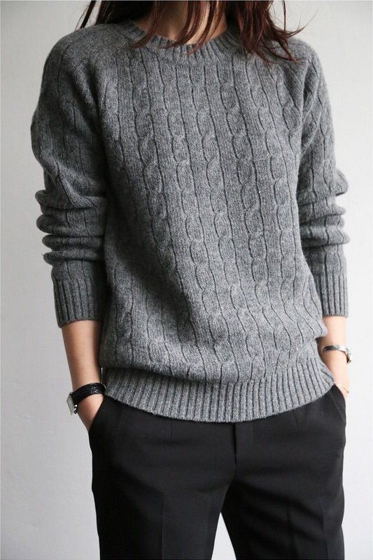 grey cable-knit sweater tucked into black trousers, fall work outfit for women over 50