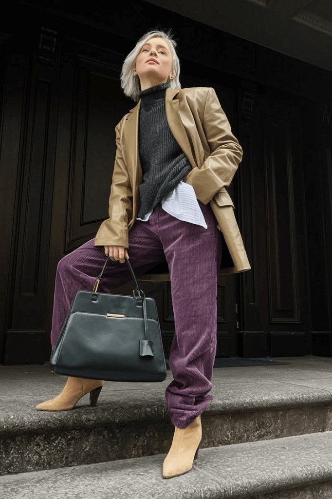 tan blazer with black top and purple wide-leg trousers, fall work outfit for women over 50