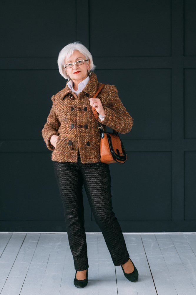 brown tweed jacket with black trousers and tan bag, fall work outfit for women over 50