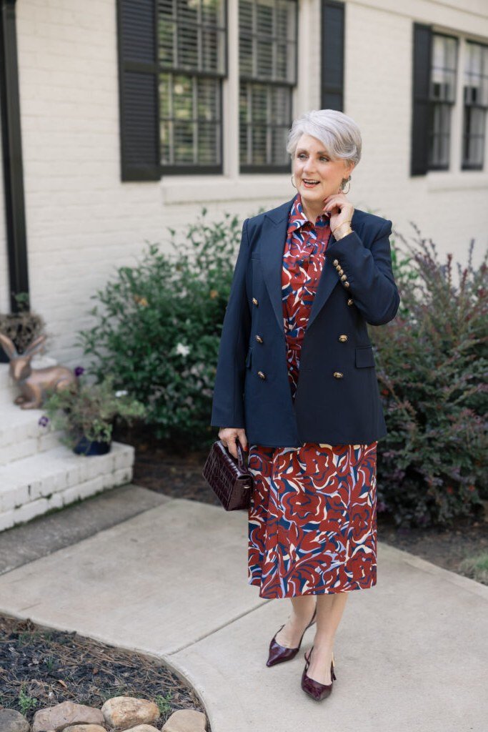 navy blazer with red floral midi skirt and burgundy heels, fall work outfit for women over 50