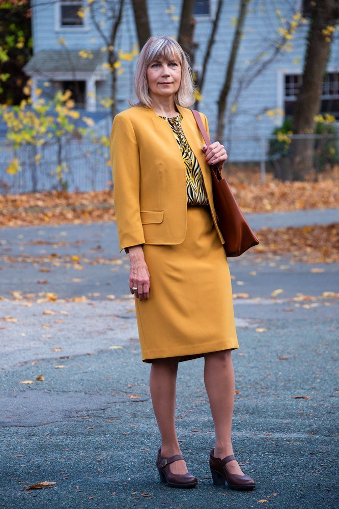 mustard skirt suit with patterned blouse, fall work outfit for women over 50