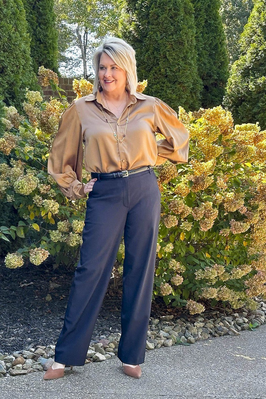 gold satin shirt with navy wide-leg trousers, fall work outfit for women over 50