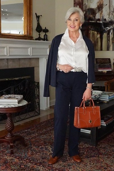 navy blazer with white blouse and orange handbag, fall work outfit for women over 50