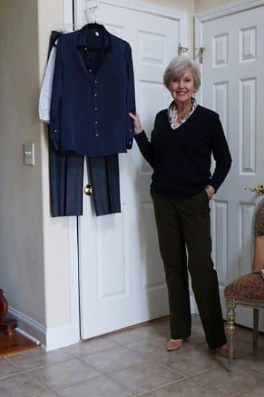 navy cardigan with black top and olive trousers, fall work outfit for women over 50