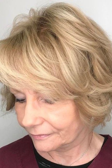 Voluminous Blonde Feathered Bob on an older woman - elegant feathered bob hairstyle idea