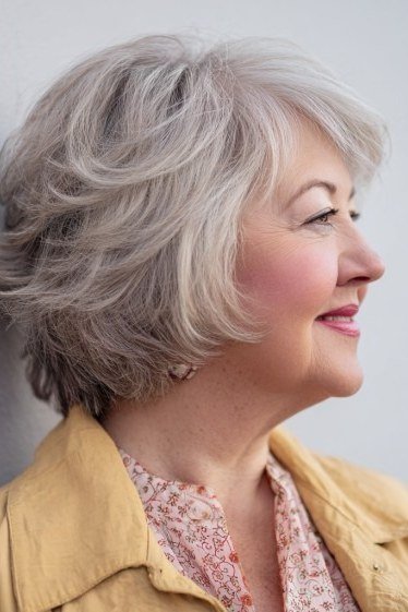 Silver Feathered Bob with Soft Waves on an older woman - elegant feathered bob hairstyle idea