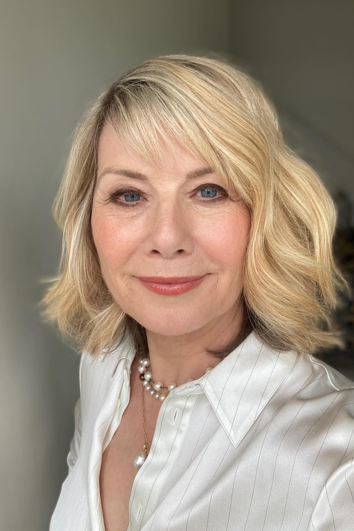 Blonde Feathered Bob with Full Layers on an older woman - elegant feathered bob hairstyle idea
