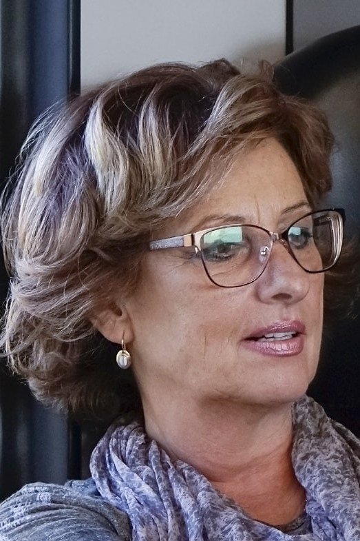 Curly Highlighted Feathered Bob on an older woman - elegant feathered bob hairstyle idea