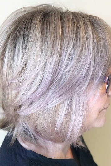 Silver-Lavender Feathered Bob on an older woman - elegant feathered bob hairstyle idea