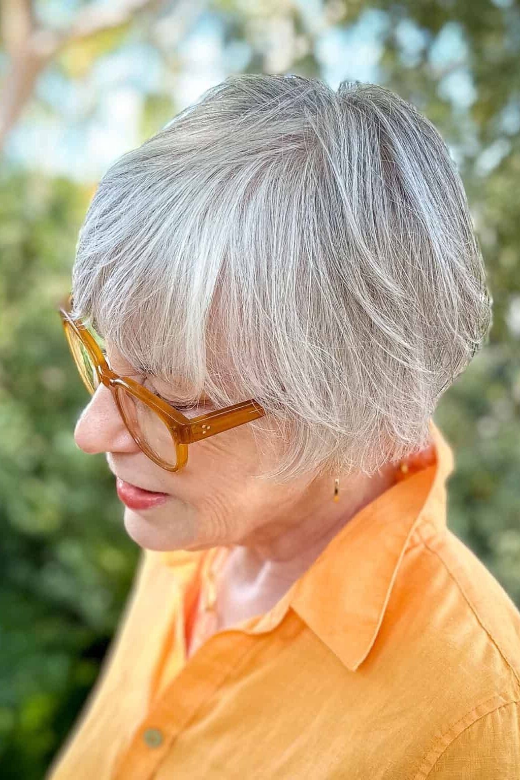 Crisp White Feathered Bob on an older woman - elegant feathered bob hairstyle idea