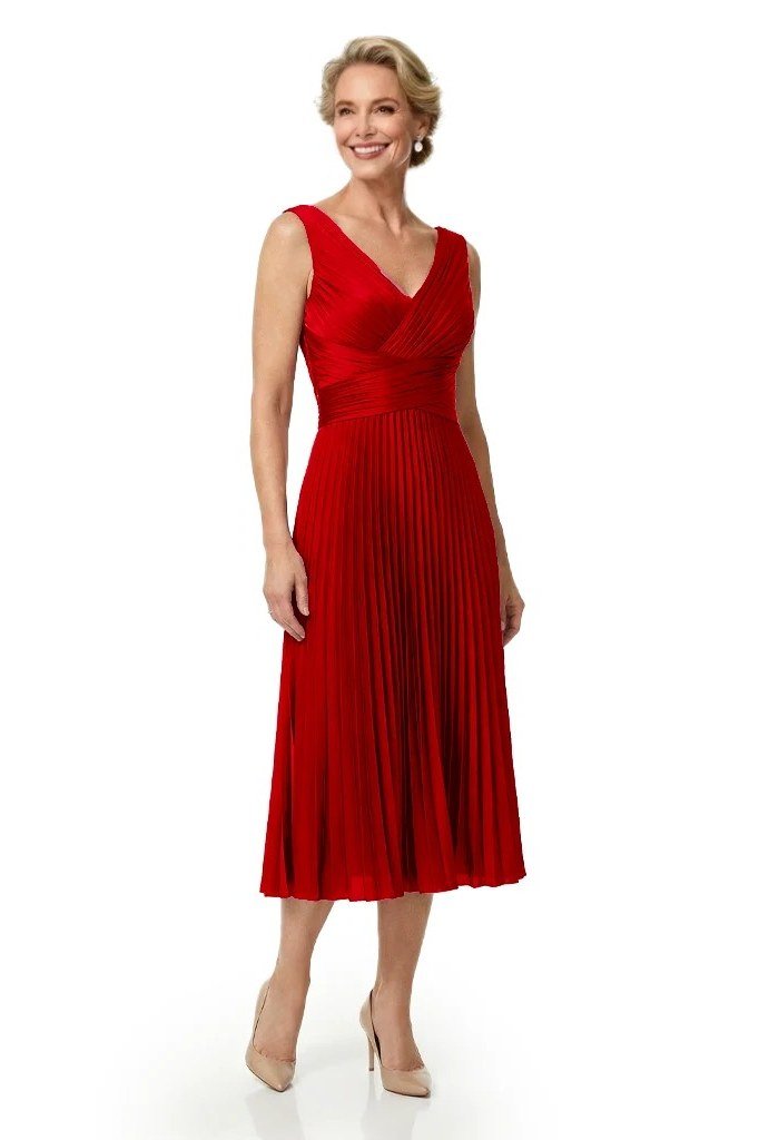 Red sleeveless fit-and-flare dress for women over 60 with pleated skirt, grey-haired model