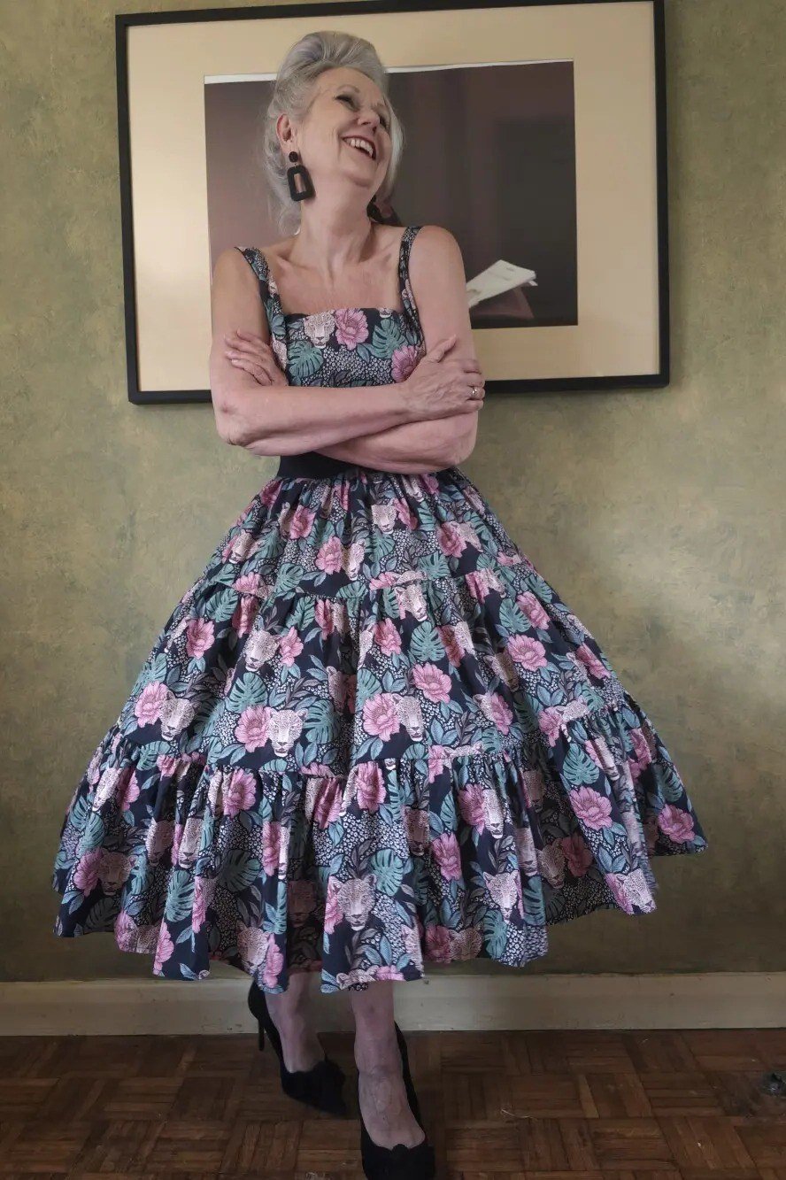 Purple floral twirl fit-and-flare dress for older women with glasses