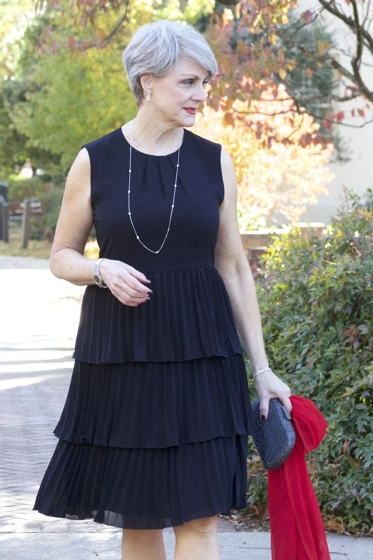 Navy tiered fit-and-flare midi dress for grey-haired woman in garden