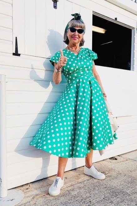 Green polka-dot twirl fit-and-flare dress for older women with sunglasses