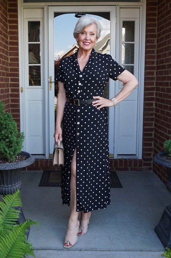 Navy polka-dot button-front fit-and-flare maxi dress for older women on porch