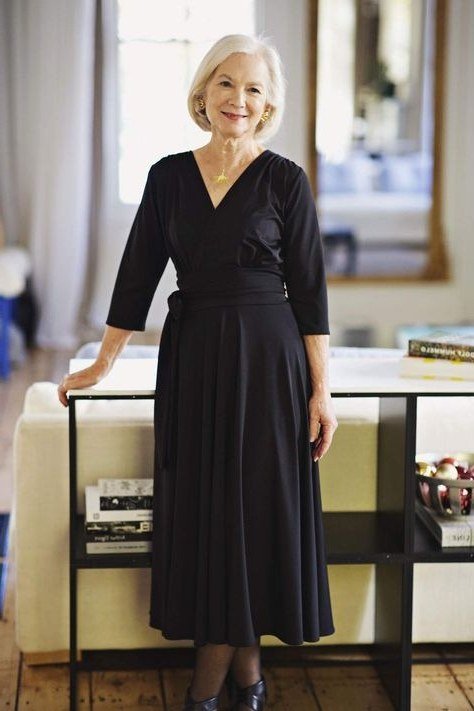 Black wrap fit-and-flare midi dress with three-quarter sleeves for blonde older woman
