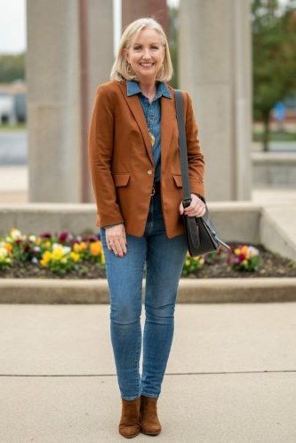 A camel blazer over a chambray shirt with light-wash jeans and brown ankle boots is smart casual perfection. Warm camel softens the blue denim. Polished for parent-teacher nights or casual Fridays. It bridges cozy and tailored beautifully.