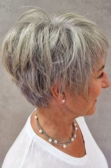 Short textured grey pixie, side profile, pearl necklaces grey hairstyle for women over 50