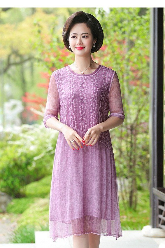 Pink lace midi dress in a garden, delicate summer occasion dress for women over 60