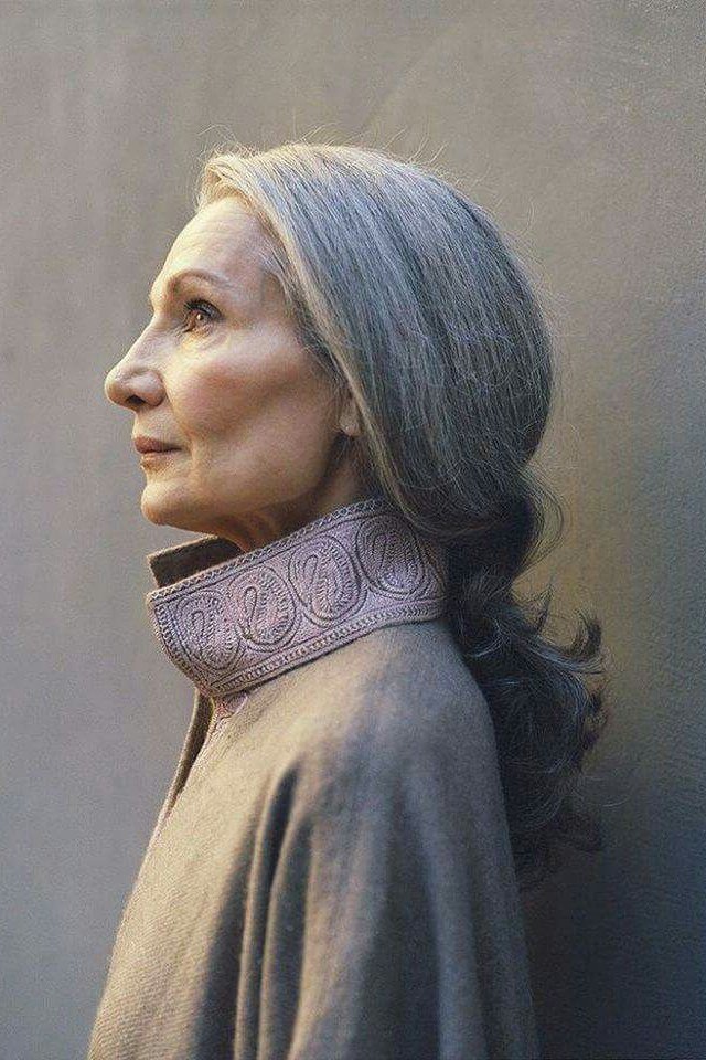Low grey ponytail, side profile, shawl grey hairstyle for women over 50
