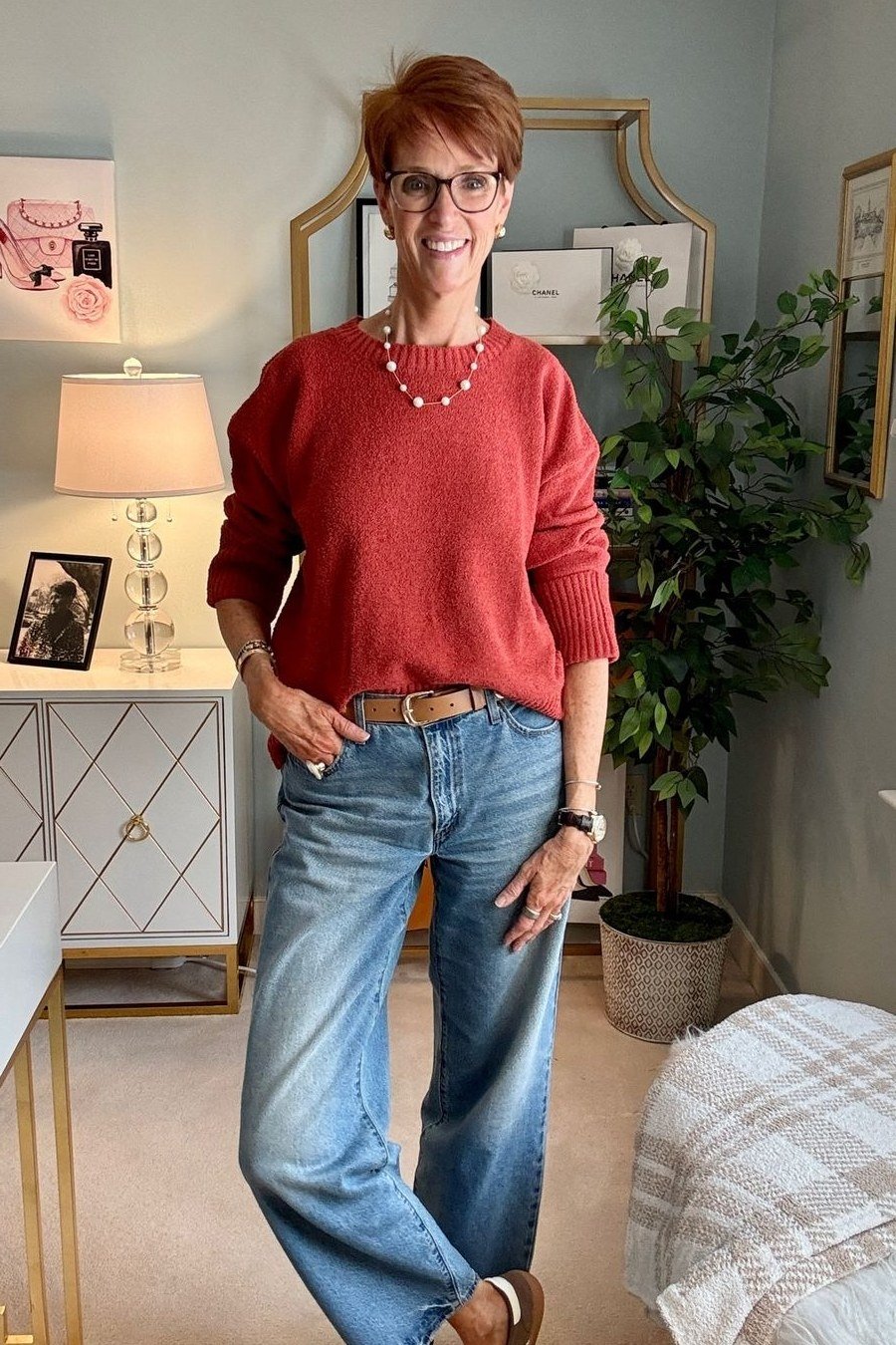 Rust colored sweater with wide-leg jeans, autumn outfit for mature women