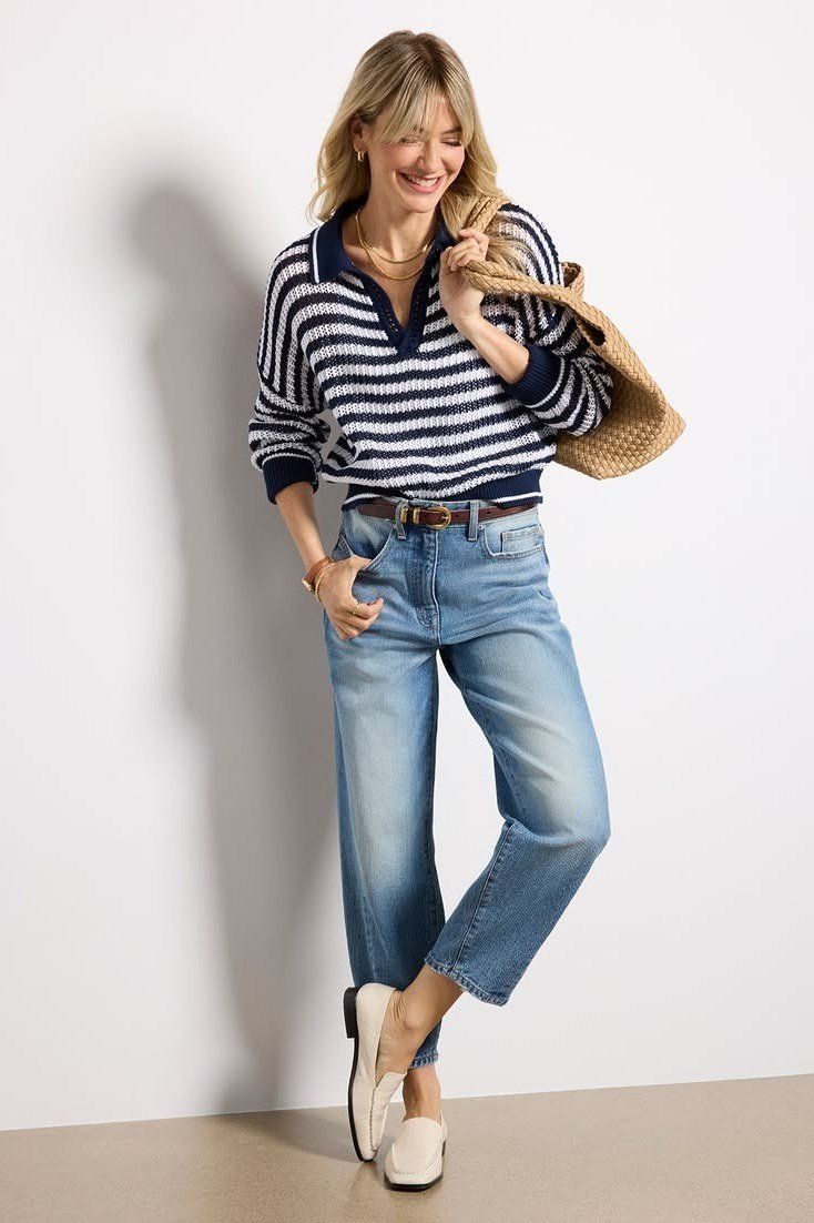 Navy and white striped polo sweater with relaxed jeans, preppy fall outfit for women over 40